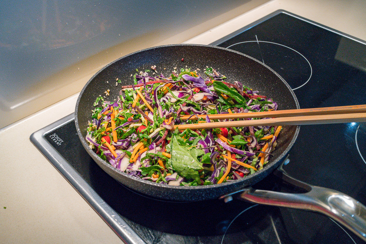 stir-frying bird"s eye chilli kale and cabbage salad