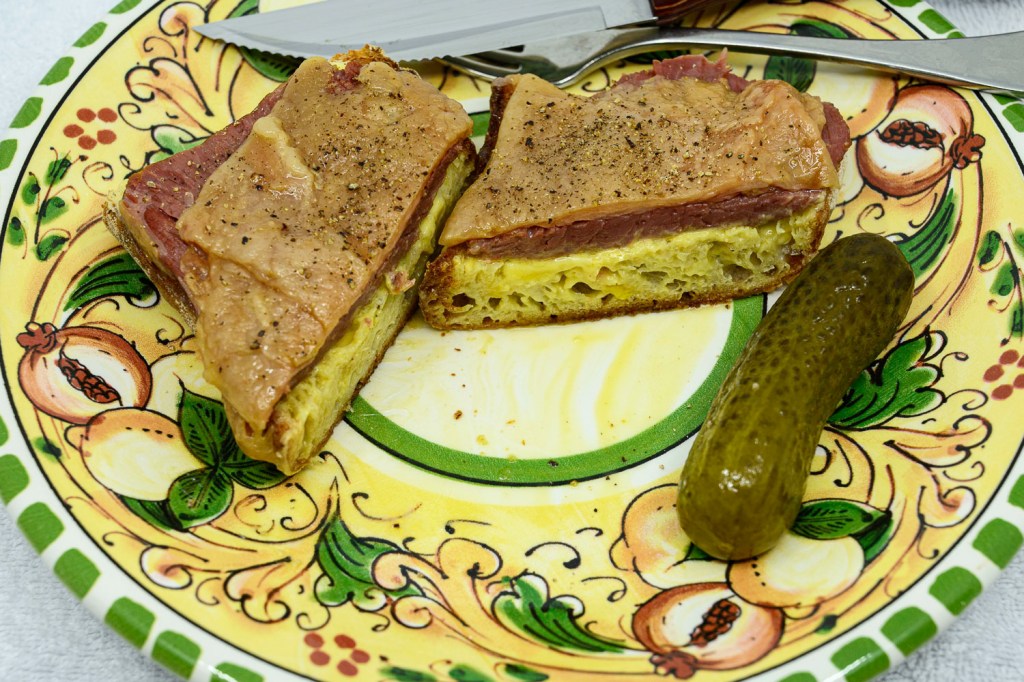 Corned beef fat sandwich with a pickle