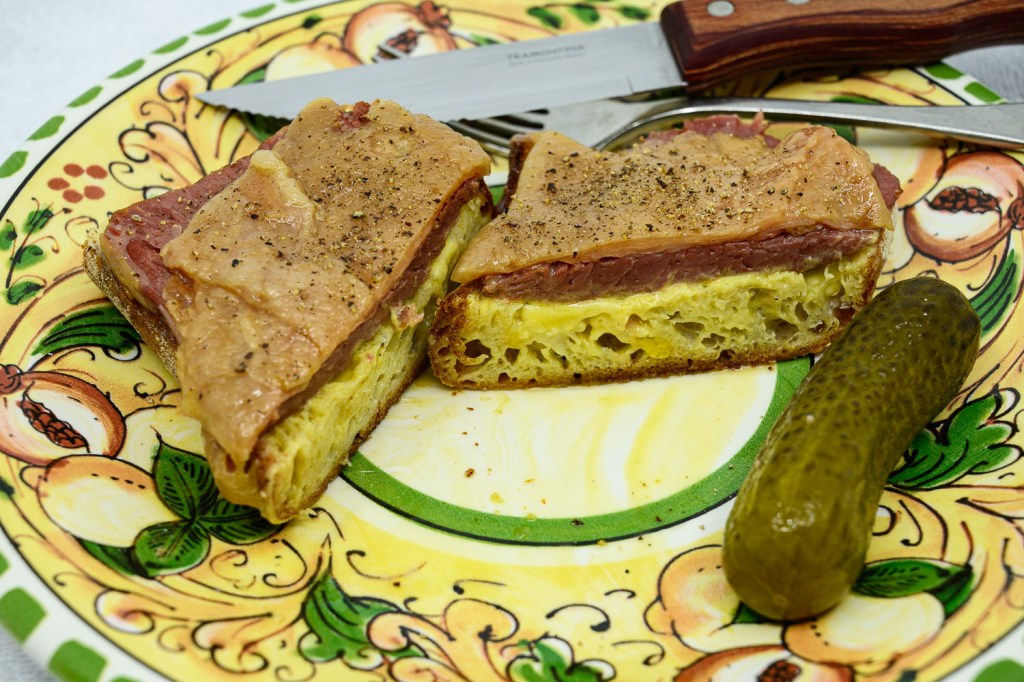 Corned beef fat sandwich with a pickle