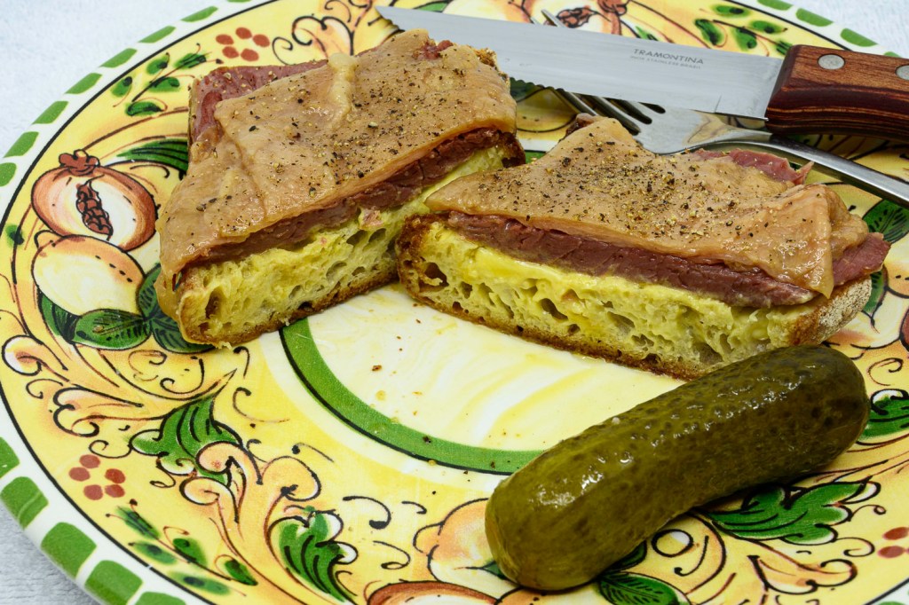 Corned beef fat sandwich with a pickle