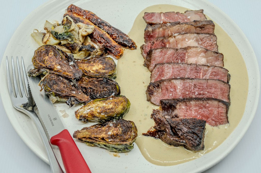 For tea, I prepared a portion of grass-fed scotch fillet steak by sous vide. Additionally, I parboiled and deep-fried Brussels sprouts, fennel, and baby carrots in beef fat to enhance their flavour. The accompanying sauce was created from the meat juices, combined with butter, cream, cream cheese, Dijon mustard, and blue cheese, creating a rich and complementary accompaniment to the dish.