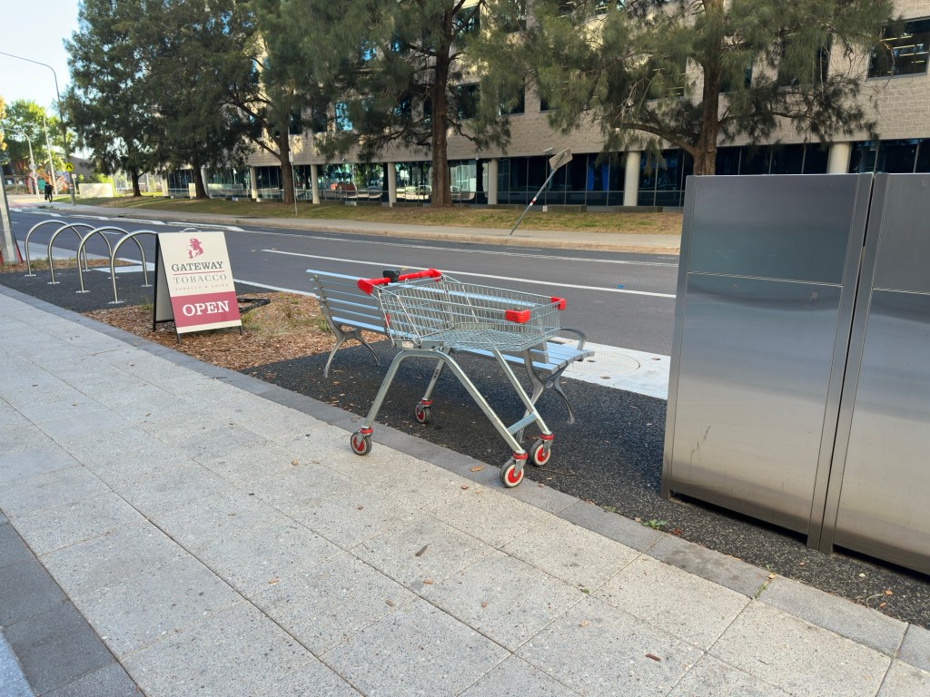 Abandoned shopping trolley on a footpath. Typical for Canberra the granny state which puts chains on trolleys.