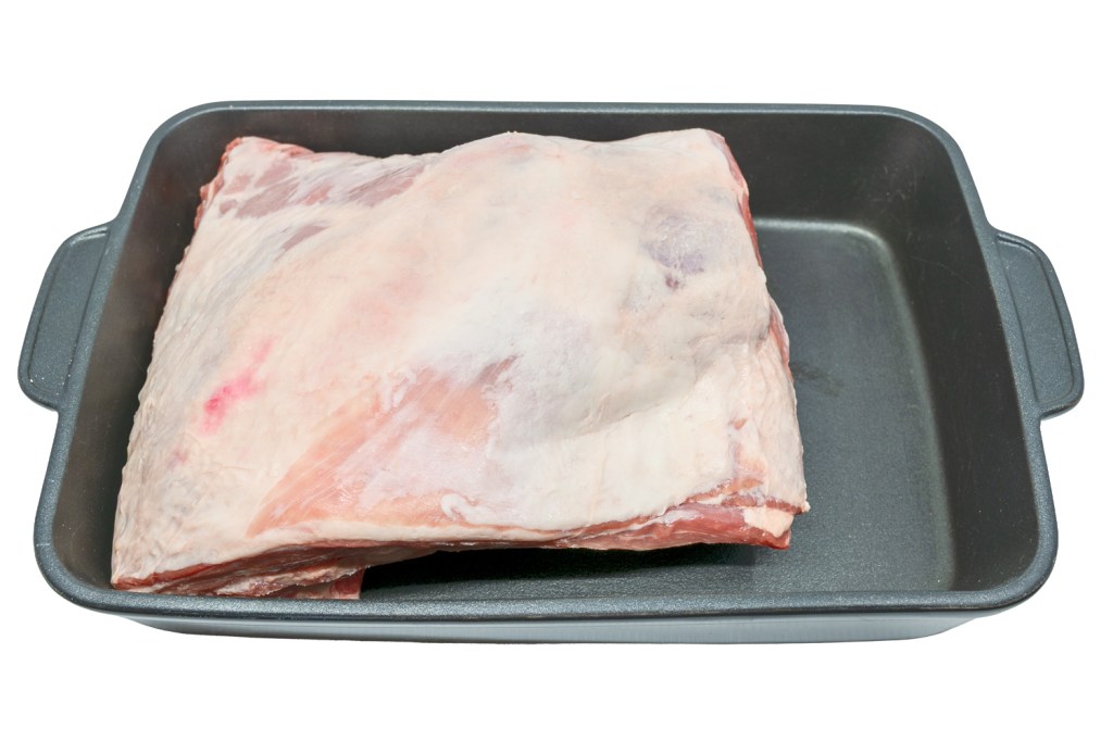 Lamb shoulder square cut in a roasting tray