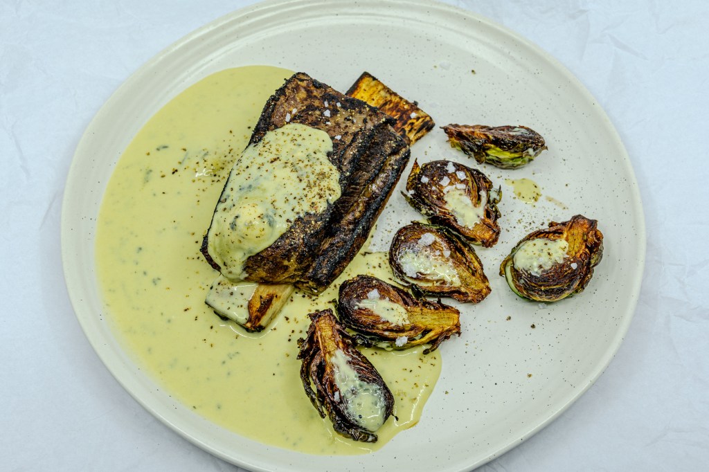 Slow-cooked beef short rib with Brussels sprouts fried in beef fat and served with blue vein cheese and mustard sauce