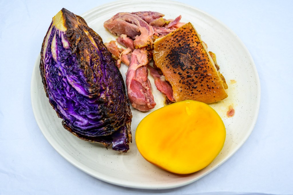 Pork shoulder hock and speck with Bowen mango and cabbage fried in beef fat