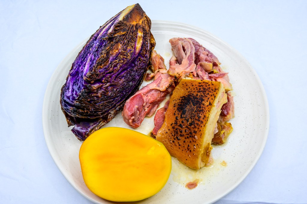 Pork shoulder hock and speck with Bowen mango and cabbage fried in beef fat