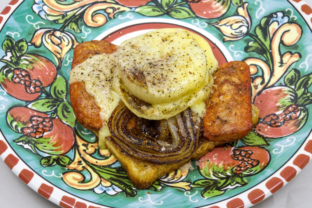 I submitted a postal vote for the South Australian election today. I made a democracy sausage. A slice of white sourdough bread with a generous layer of whipped Vegemite butter for lubrication and umami. One kransky and cheese sausage cut longitudinally and then bisected. Cooked on a cast-iron flat-top in the Weber Q+. A couple of slices of brown onion. Cooked on a cast-iron flat-top in the Weber Q+. The sausage was loaded onto the bread, and then the onion, and then a couple of pieces of aged cheddar cheese. I finished it on the Weber Q+ with the hood down, so the cheese started to melt, and the sourdough was fried in beef fat and whipped Vegemite butter.