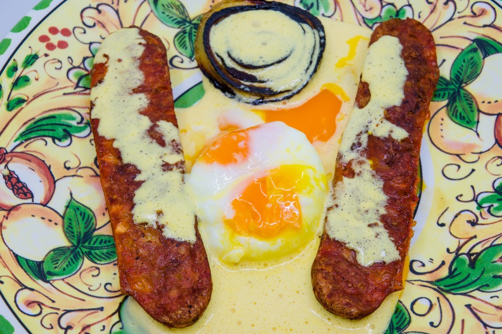 Democracy sausage, cooked in the Weber Q+ with some white onion, was served with a couple of poached eggs and freshly made Hollandaise sauce. The sauce was delicious, made with three egg yolks, freshly squeezed lemon juice Vegemite and melted salted butter. However, the poached egg yolks broke prematurely creating a mess on the plate.