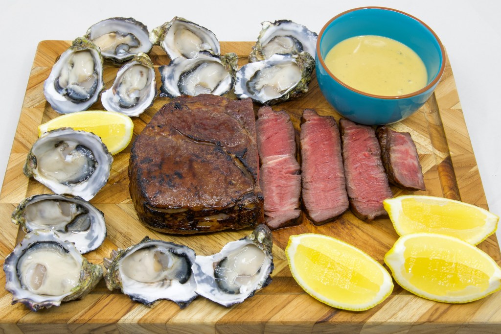 Medium rare grass-fed scotch fillet steak with a dozen fresh oysters and the most umami Vegemite blue vein cheese sauce