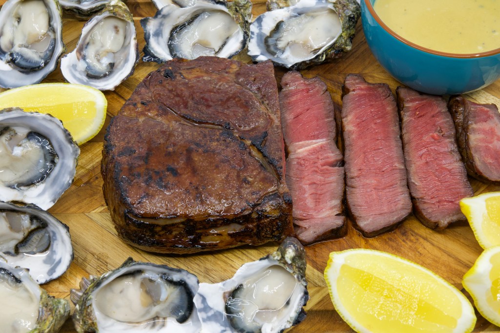 Medium rare grass-fed scotch fillet steak with a dozen fresh oysters and the most umami Vegemite blue vein cheese sauce