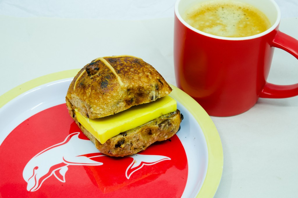 Grass-fed butter with a Hot Cross Bun and coffee. Rather than enjoying a stick of grass-fed butter neat, Ihad a Hot Cross Bun and coffee witht!