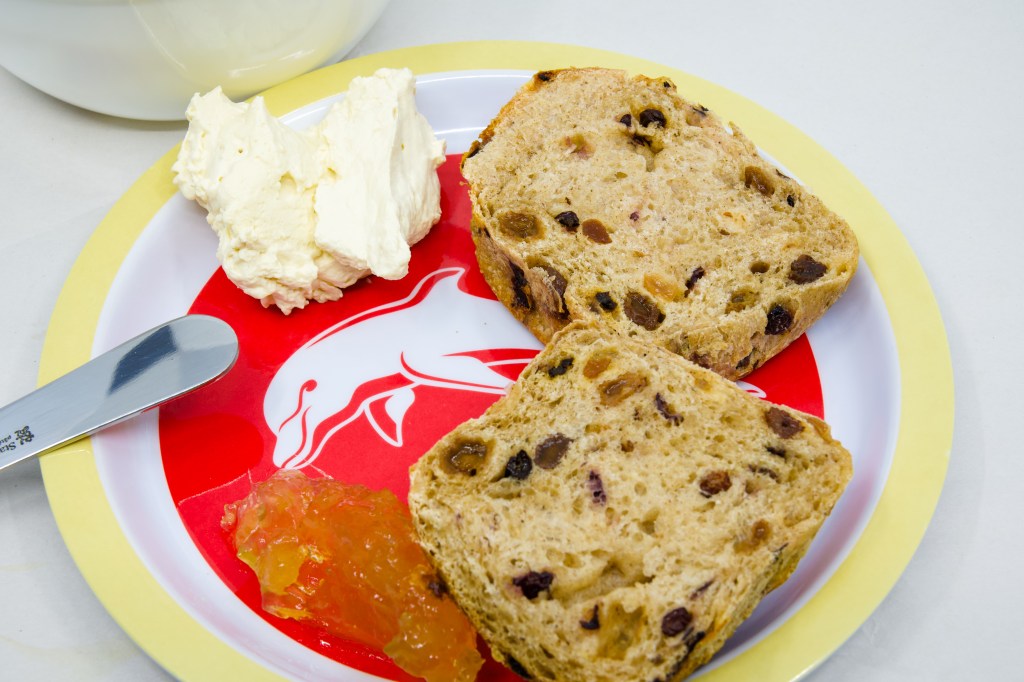 Hot Cross Bun with vanilla whipped cream and ginger marmalade