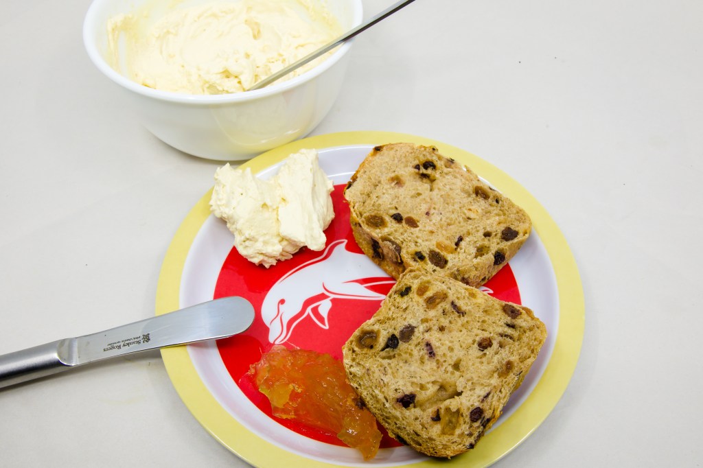 Hot Cross Bun with vanilla whipped cream and ginger marmalade