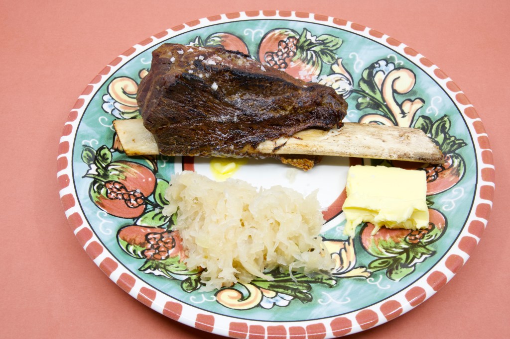 Beef short rib with Polish sauerkraut and cultured butter. The beef short rib was cooked in the slow cooker for 8 hours on low heat. It was seared on my Weber Q+ With a gas torch.
