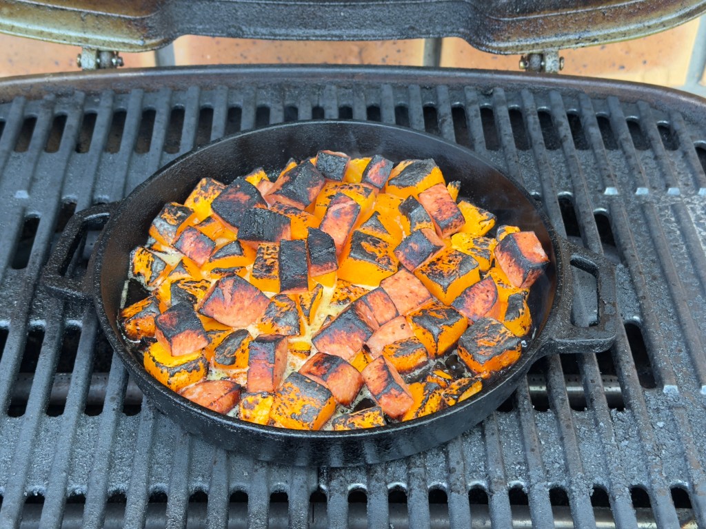 Diced Spam and pumpkin in a cast-iron pan