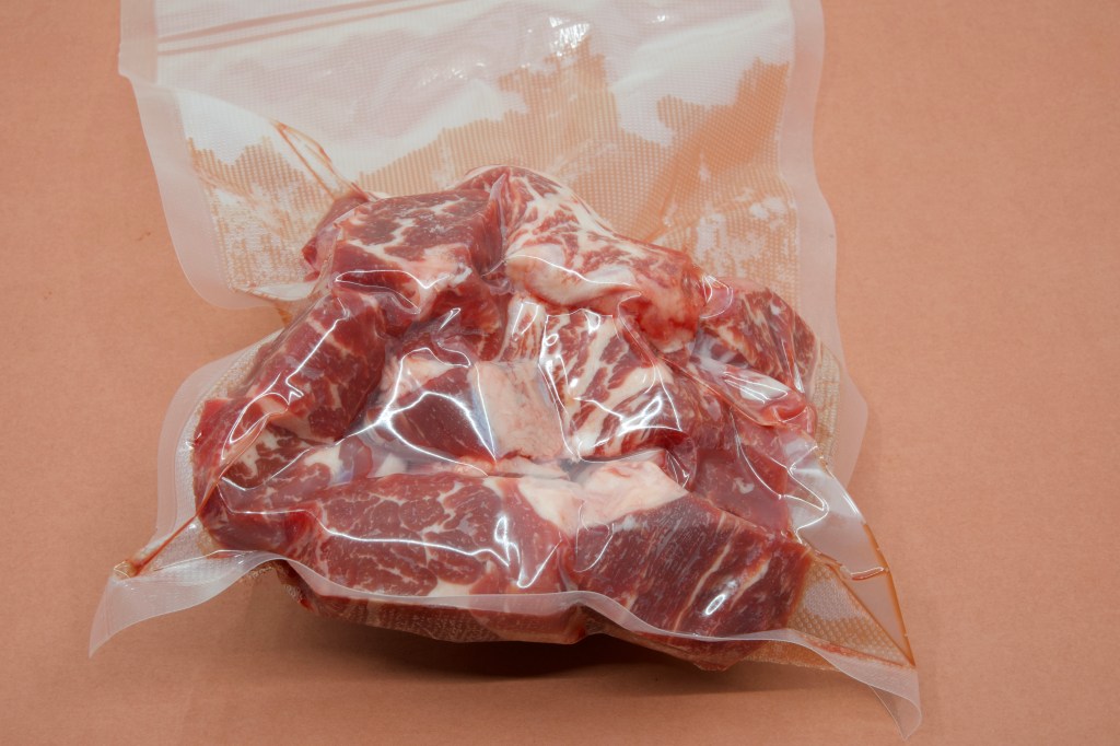 Beef short rib meat diced and vacuum bagged