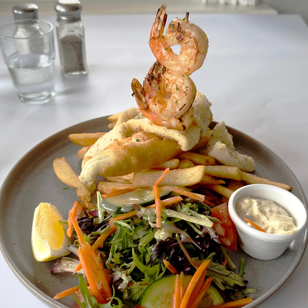 Secrets Trio King George Whiting, skewered prawns, and calamari at Secrets by the Sea