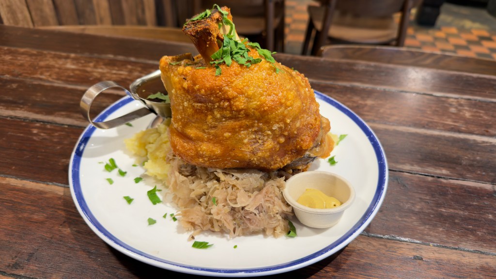 Hahndorf Inn crispy skin pork knuckle, sauerkraut, mustard, mashed potato, and gravy