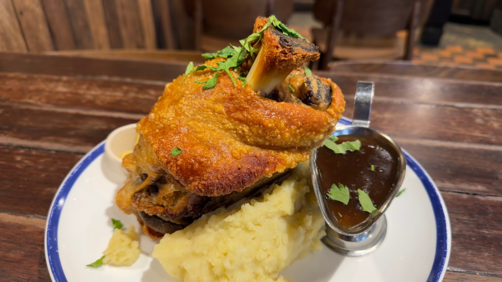 Hahndorf Inn crispy skin pork knuckle, sauerkraut, mustard, mashed potato, and gravy
