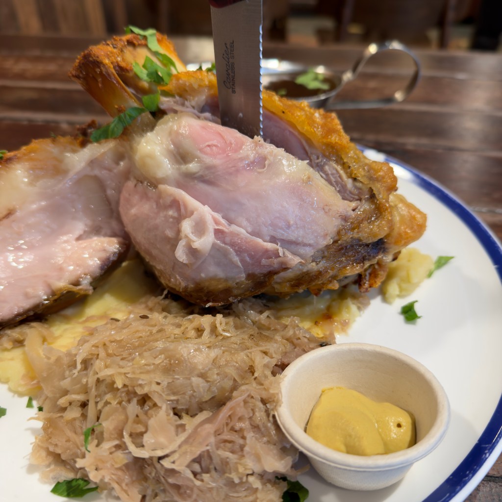 Hahndorf Inn crispy skin pork knuckle, sauerkraut, mustard, mashed potato, and gravy