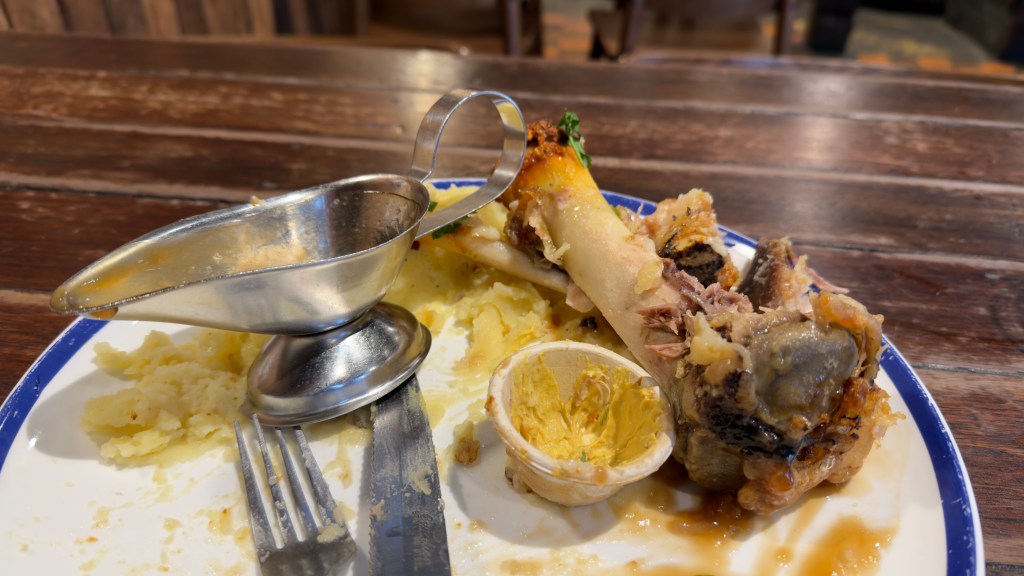 Hahndorf Inn crispy skin pork knuckle, sauerkraut, mustard, mashed potato, and gravy