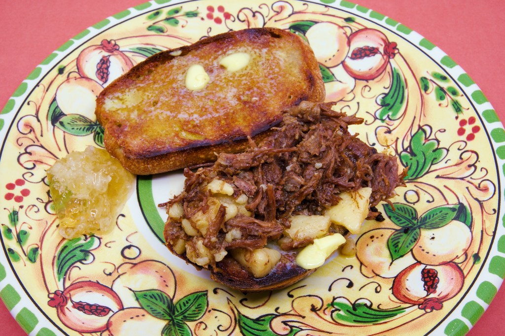 Leftover beef short rib on a toasted, double-buttered fresh rye sourdough roll.